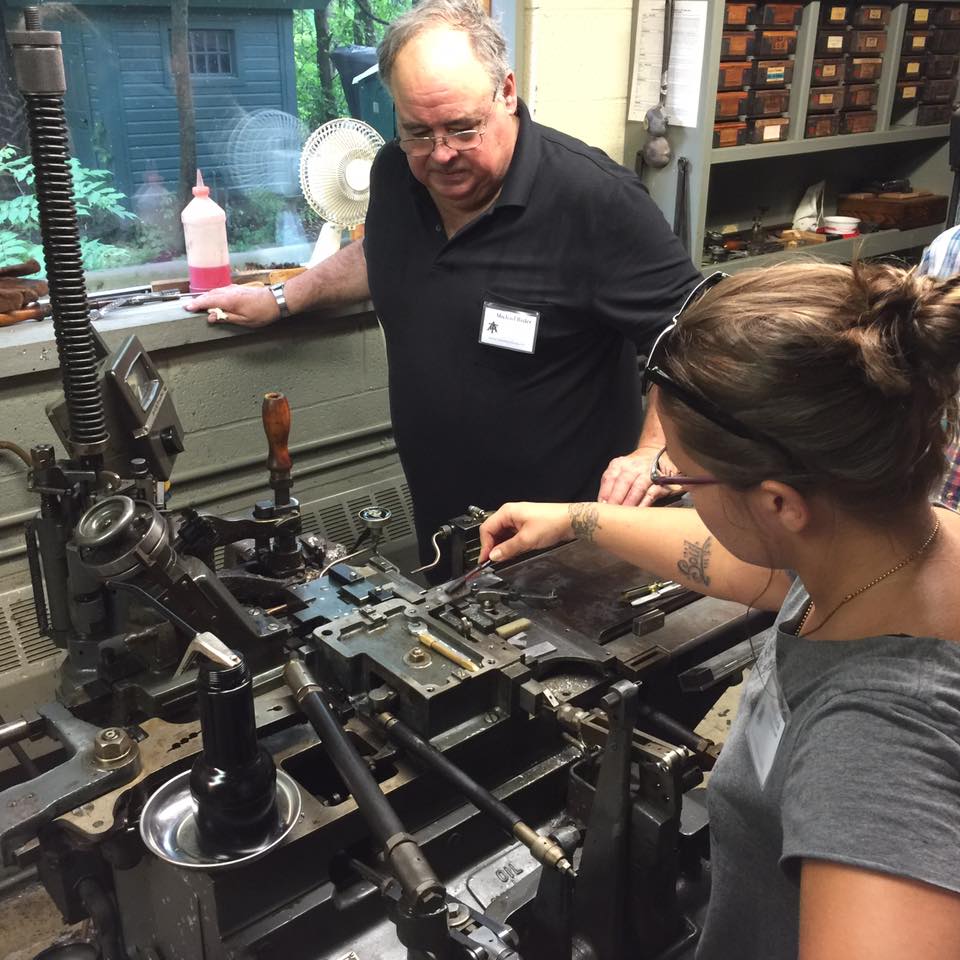 Jessie casting on the Super Caster, Michael Bixler watching. 