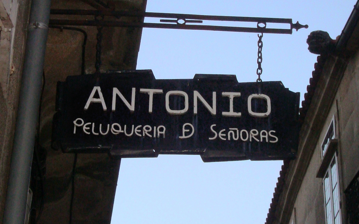 This sign for a hairdresser caught my attention because of the manner in which the  letters in the second line were created. The designer has even created a new shape with the letters D an E together in a single glyph.