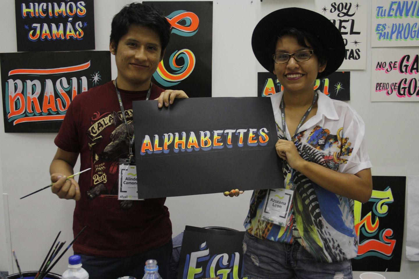Alinder and Azucena holding the Alphabettes header