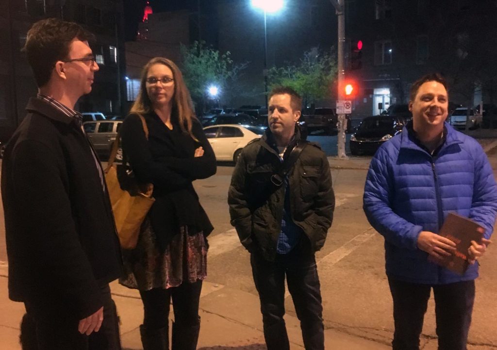 Type designers standing on a street corner at night in Kansas City