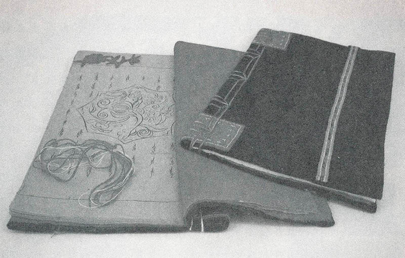 Photograph of two Third Day Book examples, one opened and one closed