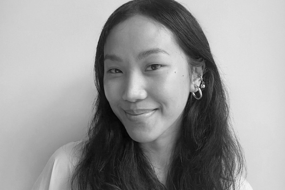 black and white headshot of a woman smiling