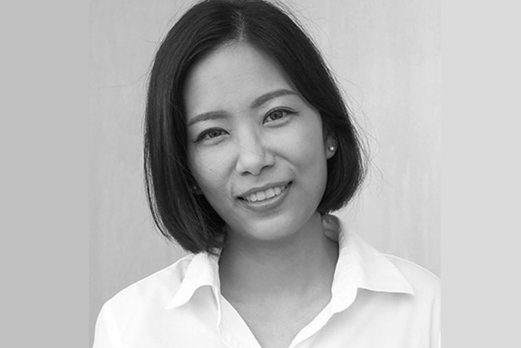 black and white headshot of a woman smiling